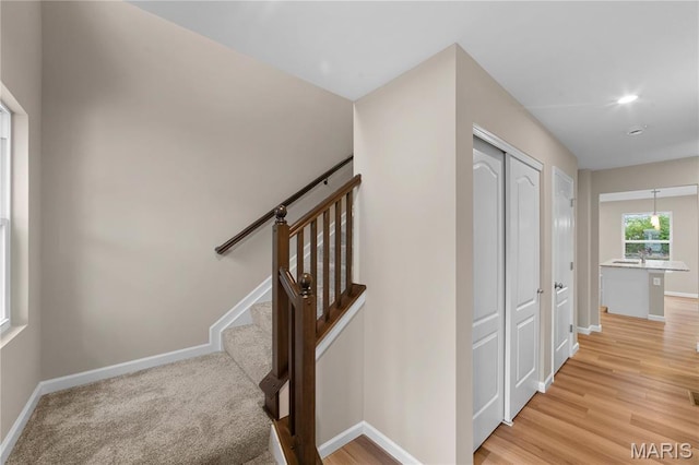 317 Newbridge Way, Ofallon, MO 63368 - corridor featuring baseboards and light wood-type flooring