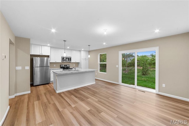 317 Newbridge Way, Ofallon, MO 63368 - kitchen featuring stainless steel appliances, white cabinetry, baseboards, light wood-style floors, and recessed lighting