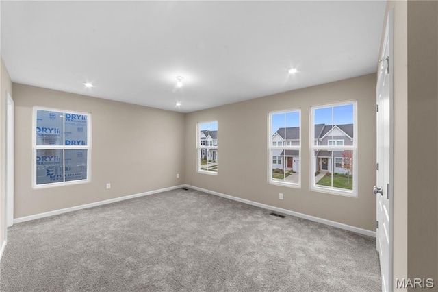 317 Newbridge Way, Ofallon, MO 63368 - carpeted spare room with plenty of natural light, baseboards, and recessed lighting