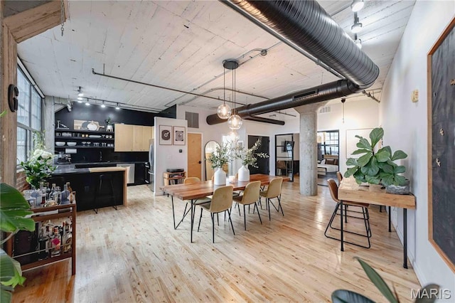 2020 Washington Ave Unit 713, Saint Louis, MO 63103 - dining space with light wood finished floors, plenty of natural light, and ornate columns