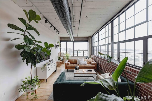 2020 Washington Ave Unit 713, Saint Louis, MO 63103 - sunroom featuring rail lighting and hardwood / wood-style floors