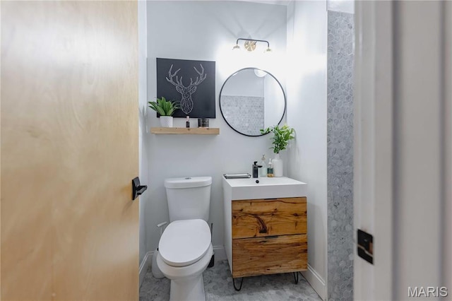 2020 Washington Ave Unit 713, Saint Louis, MO 63103 - half bath with toilet, baseboards, and vanity
