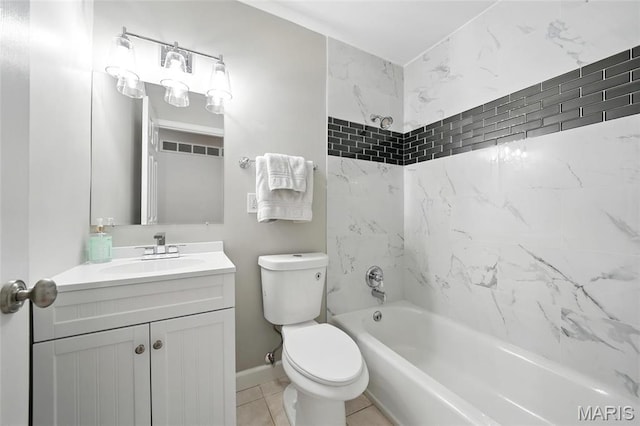 bathroom with vanity, toilet, shower / washtub combination, tile patterned flooring, and baseboards