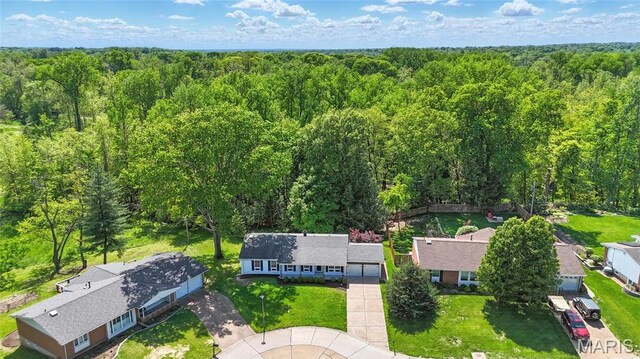 aerial view of residential area with a forest