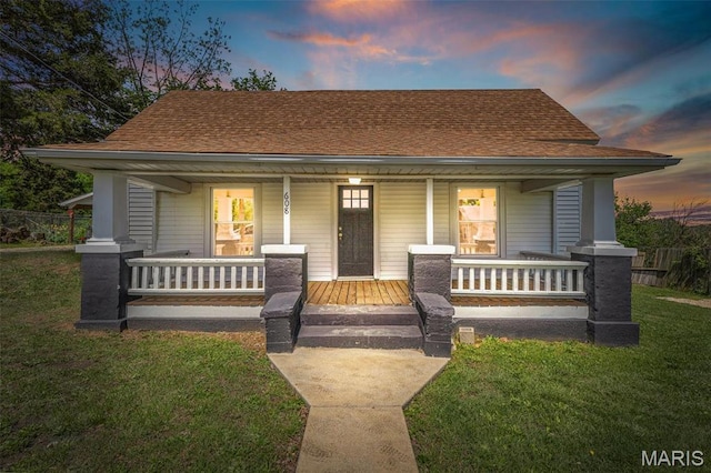 608 W Main St, Park Hills, MO 63601 - bungalow-style home featuring a porch, a lawn, and a shingled roof