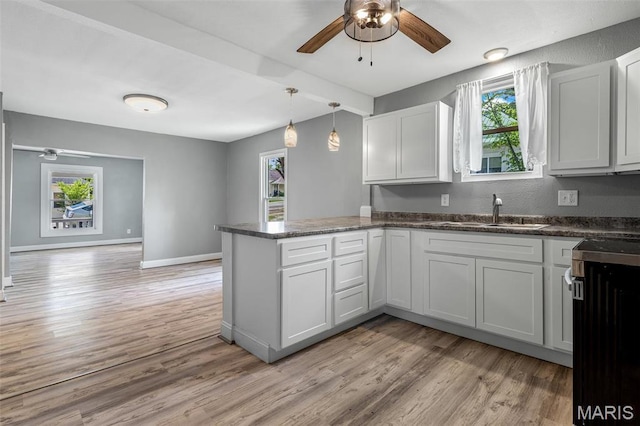 608 W Main St, Park Hills, MO 63601 - kitchen with ceiling fan, a sink, a peninsula, and healthy amount of natural light