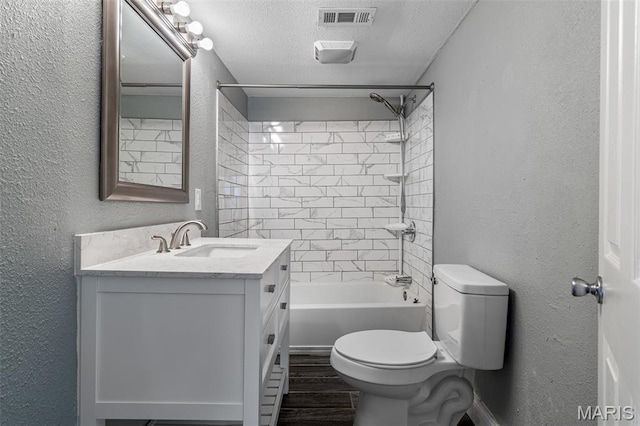 608 W Main St, Park Hills, MO 63601 - bathroom with toilet, a textured wall, a textured ceiling, vanity, and wood finished floors