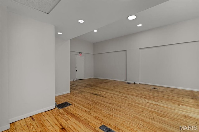 6330 Clayton Ave, Saint Louis, MO 63139 - empty room featuring baseboards, wood finished floors, and recessed lighting