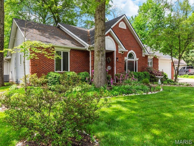 2700 Woods Way, Belleville, IL 62221 - view of front of house with brick siding, a garage, a front yard, driveway, and roof with shingles