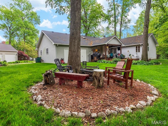 2700 Woods Way, Belleville, IL 62221 - back of house featuring an outdoor fire pit, a yard, and a patio
