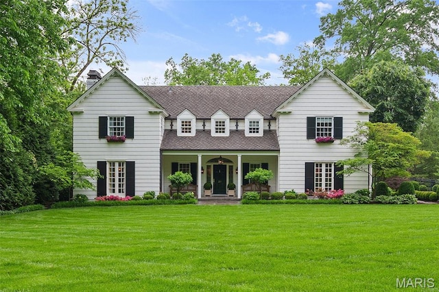 20 Picardy Ln, Ladue, MO 63124 - view of front of house with a front yard, a chimney, a porch, and roof with shingles