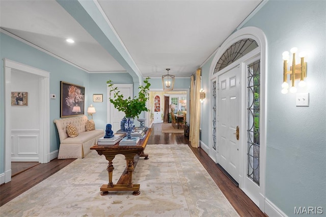 20 Picardy Ln, Ladue, MO 63124 - foyer entrance featuring dark wood-style floors, baseboards, and ornamental molding