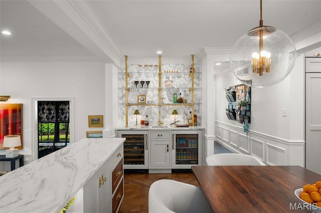 20 Picardy Ln, Ladue, MO 63124 - indoor wet bar featuring wine cooler, crown molding, recessed lighting, decorative light fixtures, and wainscoting