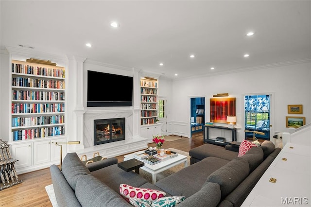 20 Picardy Ln, Ladue, MO 63124 - living room with ornamental molding, built in features, wood finished floors, recessed lighting, and a high end fireplace