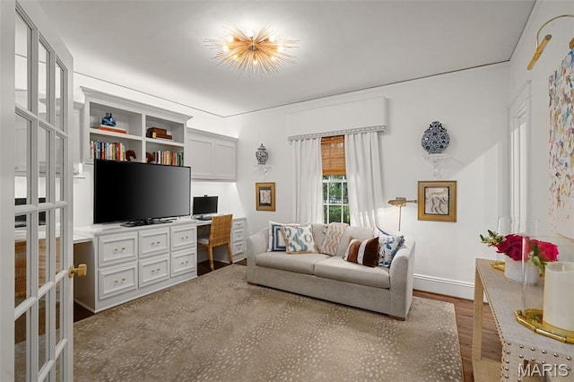20 Picardy Ln, Ladue, MO 63124 - living room with wood finished floors, french doors, and baseboards