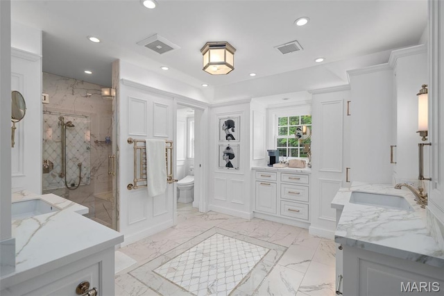 20 Picardy Ln, Ladue, MO 63124 - bathroom with a marble finish shower, recessed lighting, two vanities, marble tiled flooring, and toilet