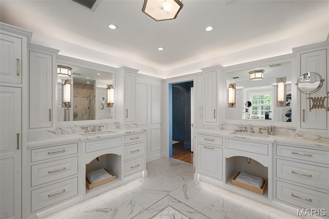 20 Picardy Ln, Ladue, MO 63124 - bathroom featuring a stall shower, marble look tiles, two vanities, recessed lighting, and a decorative wall