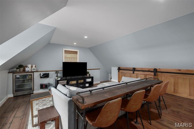 20 Picardy Ln, Ladue, MO 63124 - living room featuring beverage cooler, wood finished floors, vaulted ceiling, baseboards, and recessed lighting