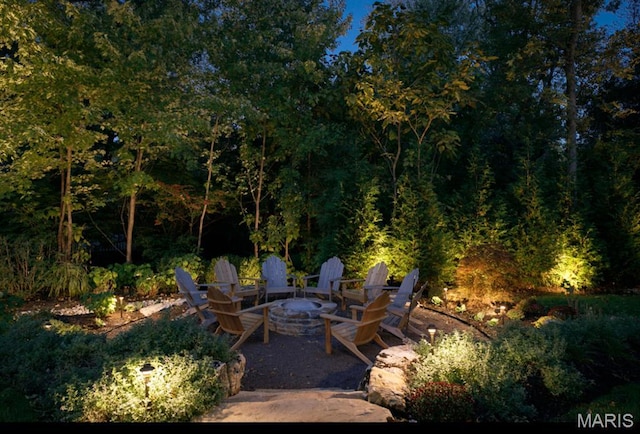 20 Picardy Ln, Ladue, MO 63124 - view of patio / terrace featuring a fire pit and a view of trees