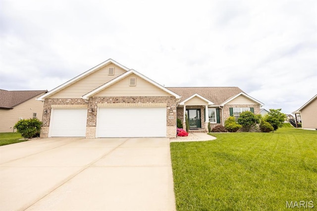 9722 Quapaw Ct, Mascoutah, IL 62258 - view of front of house with brick siding, a garage, a front lawn, and concrete driveway