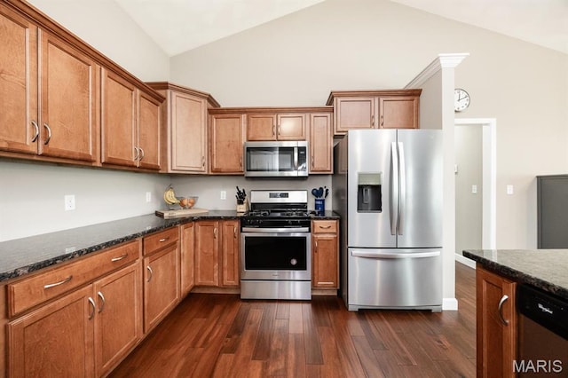 9722 Quapaw Ct, Mascoutah, IL 62258 - kitchen with stainless steel appliances, lofted ceiling, dark wood-style floors, brown cabinetry, and dark stone counters