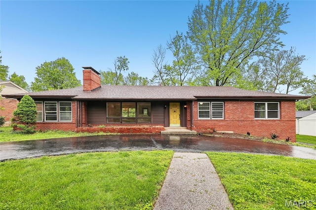 18 Spoede Hills Dr, Saint Louis, MO 63141 - ranch-style home with a chimney, a front lawn, and brick siding