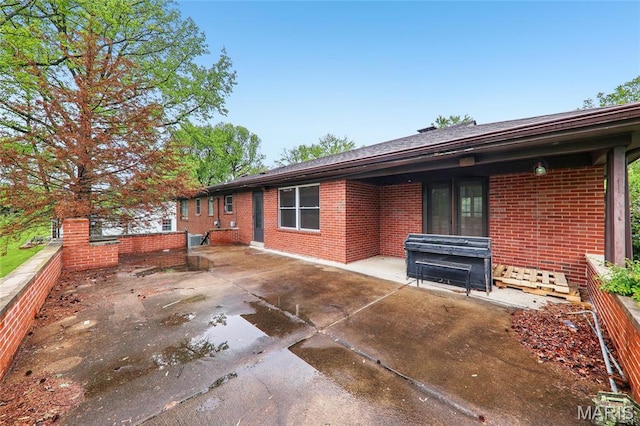 18 Spoede Hills Dr, Saint Louis, MO 63141 - back of property featuring a patio area and brick siding