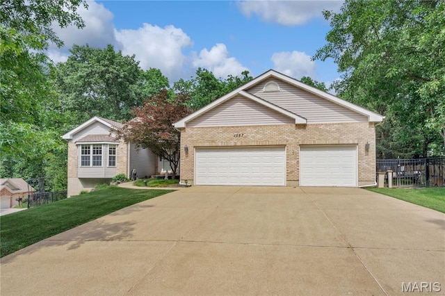 1587 Paradise Valley Dr, High Ridge, MO 63049 - ranch-style home with brick siding, concrete driveway, and a garage