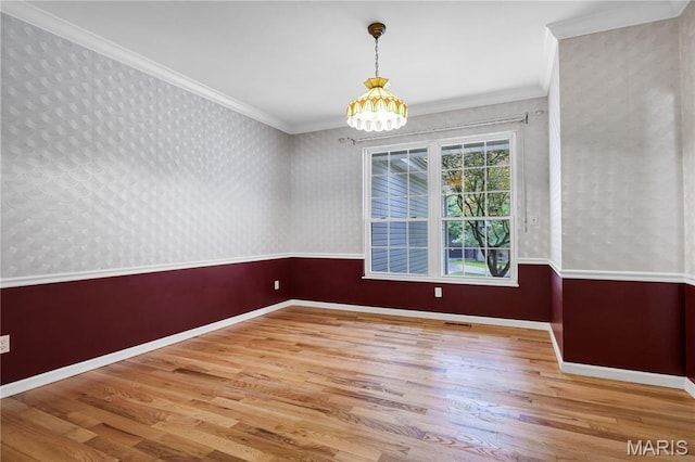 1587 Paradise Valley Dr, High Ridge, MO 63049 - unfurnished dining area featuring wood finished floors, a chandelier, ornamental molding, and wallpapered walls