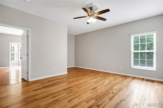 1587 Paradise Valley Dr, High Ridge, MO 63049 - empty room featuring light wood finished floors and ceiling fan