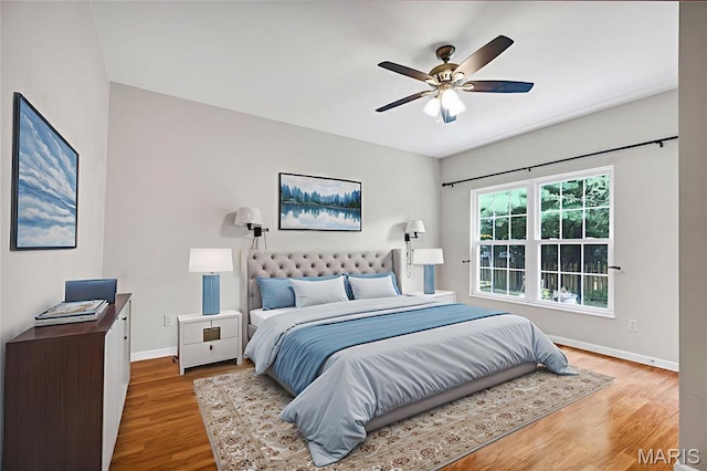 1587 Paradise Valley Dr, High Ridge, MO 63049 - bedroom with wood finished floors and a ceiling fan