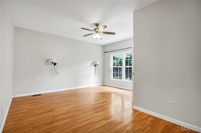 1587 Paradise Valley Dr, High Ridge, MO 63049 - unfurnished room featuring light wood-style flooring and ceiling fan