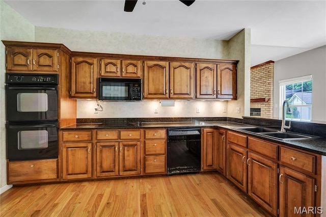 1587 Paradise Valley Dr, High Ridge, MO 63049 - kitchen with black appliances, a ceiling fan, light wood-style flooring, and dark countertops