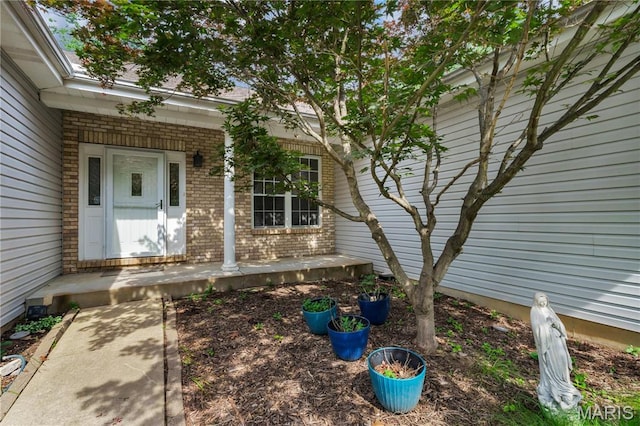 1587 Paradise Valley Dr, High Ridge, MO 63049 - entrance to property featuring brick siding and covered porch