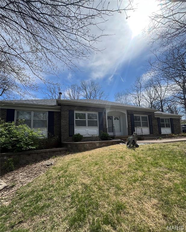 12030 Country Club Dr, Rolla, MO 65401 - single story home with a front yard and brick siding