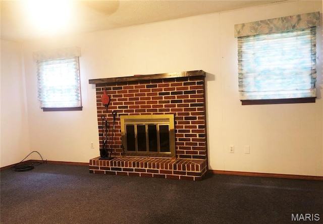 603 W Bloomfield Ave, Bloomfield, MO 63825 - detailed view of a brick fireplace, carpet, and baseboards
