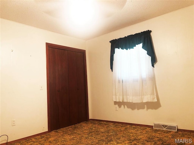 603 W Bloomfield Ave, Bloomfield, MO 63825 - carpeted spare room featuring baseboards