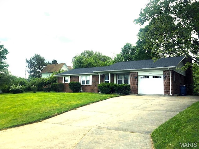 603 W Bloomfield Ave, Bloomfield, MO 63825 - ranch-style home with a garage, driveway, a front lawn, and brick siding