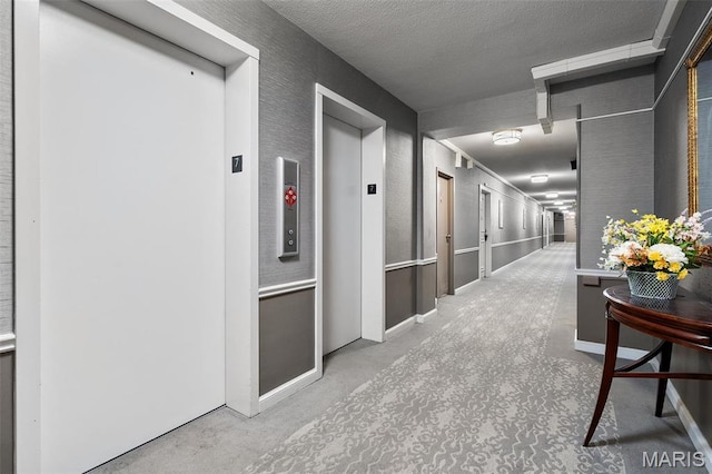 900 S Hanley Rd Unit 7B, Saint Louis, MO 63105 - corridor with elevator and carpet flooring