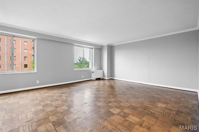 900 S Hanley Rd Unit 7B, Saint Louis, MO 63105 - unfurnished room featuring radiator, ornamental molding, and baseboards