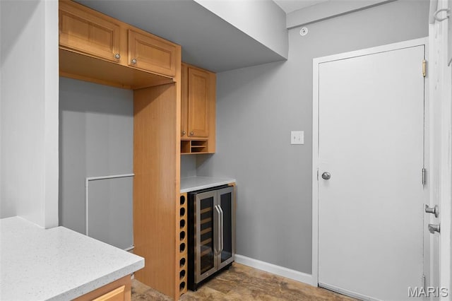 900 S Hanley Rd Unit 7B, Saint Louis, MO 63105 - bar area with beverage cooler and baseboards