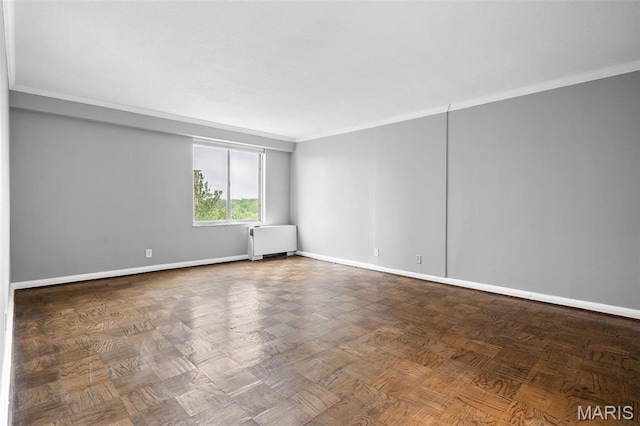 900 S Hanley Rd Unit 7B, Saint Louis, MO 63105 - unfurnished room featuring radiator, ornamental molding, and baseboards