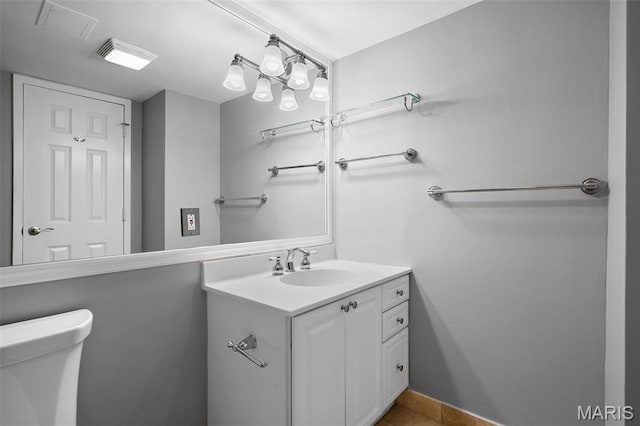 900 S Hanley Rd Unit 7B, Saint Louis, MO 63105 - bathroom featuring vanity, toilet, and tile patterned floors