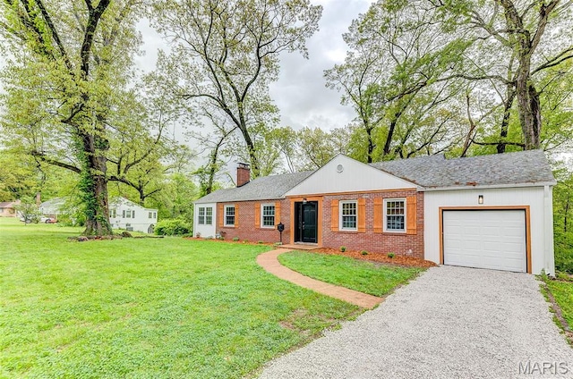 14 Carson Dr, Belleville, IL 62223 - ranch-style home with a garage, a chimney, driveway, a front lawn, and brick siding