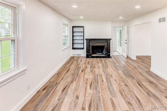 14 Carson Dr, Belleville, IL 62223 - unfurnished living room with light wood-style flooring, baseboards, a fireplace, and recessed lighting