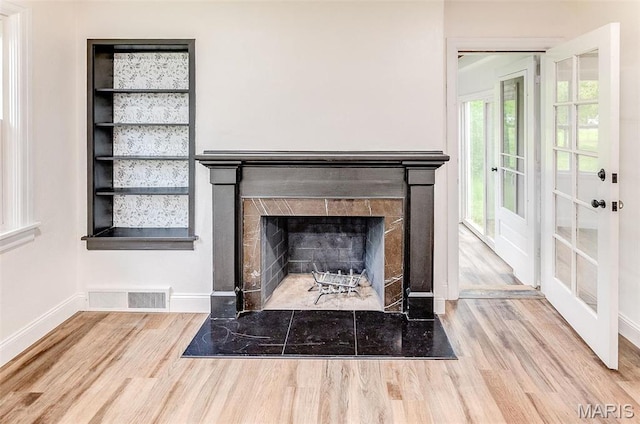 14 Carson Dr, Belleville, IL 62223 - detailed view of wood finished floors, a tiled fireplace, and baseboards