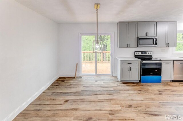 14 Carson Dr, Belleville, IL 62223 - kitchen featuring appliances with stainless steel finishes, light wood-type flooring, and gray cabinetry