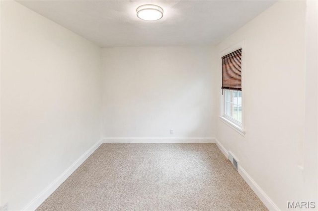 14 Carson Dr, Belleville, IL 62223 - empty room featuring light carpet and baseboards