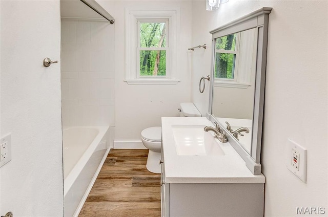 14 Carson Dr, Belleville, IL 62223 - bathroom with toilet, wood finished floors, vanity, baseboards, and washtub / shower combination