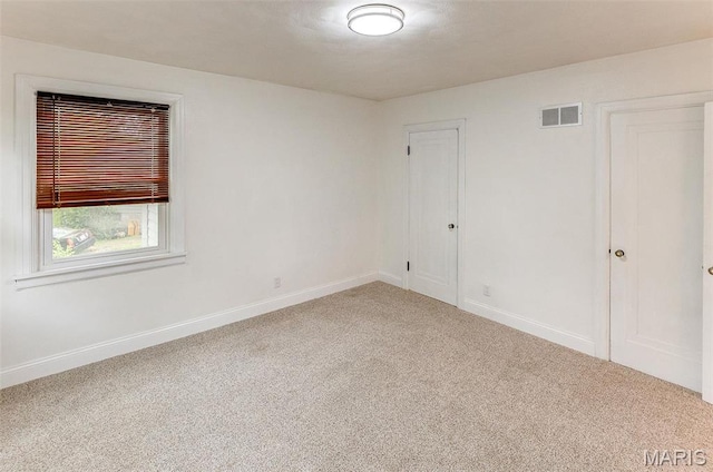 14 Carson Dr, Belleville, IL 62223 - carpeted empty room with baseboards